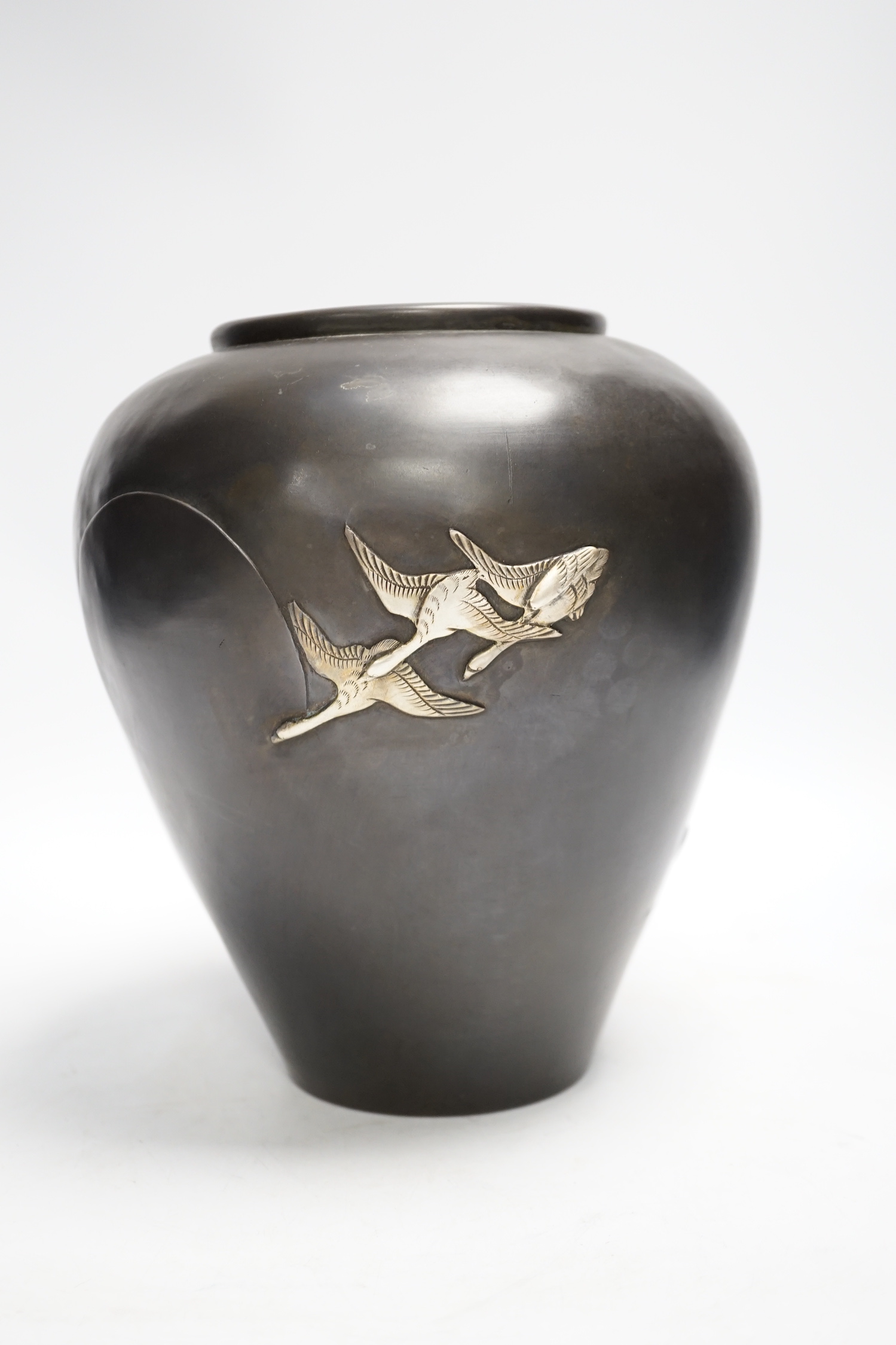 A Japanese white metal overlaid bronze vase, Meiji period, 21cm